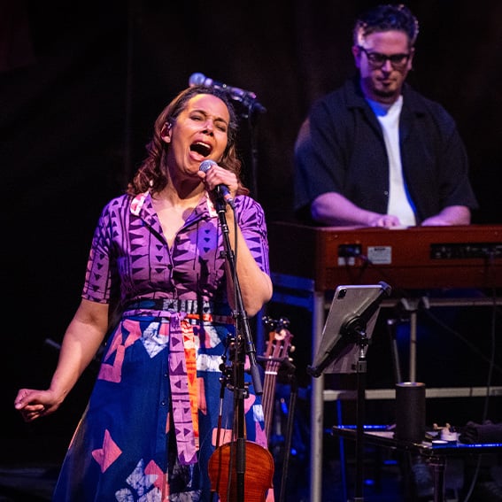 rhiannon singing on stage